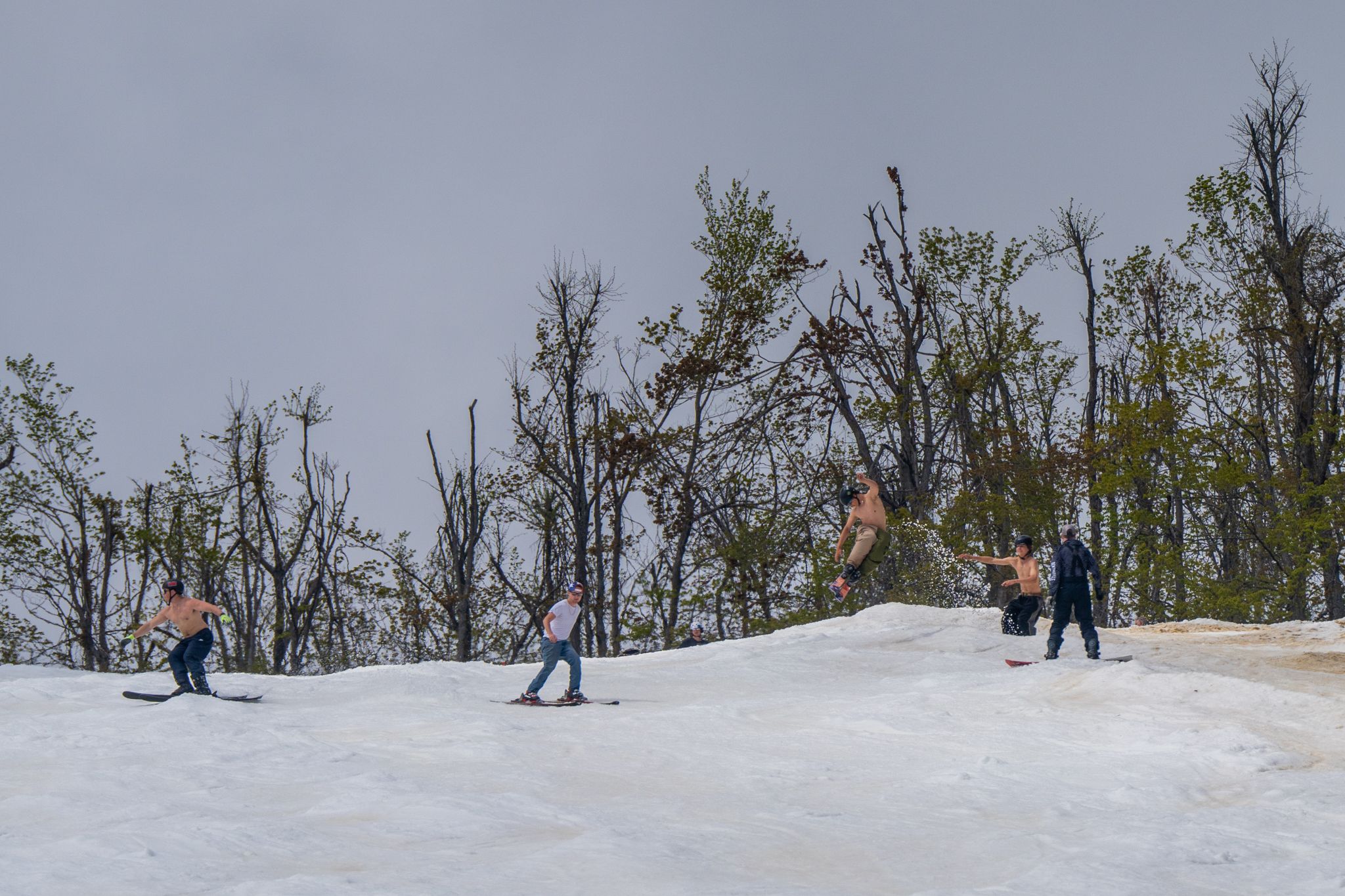 skiers hitting jump