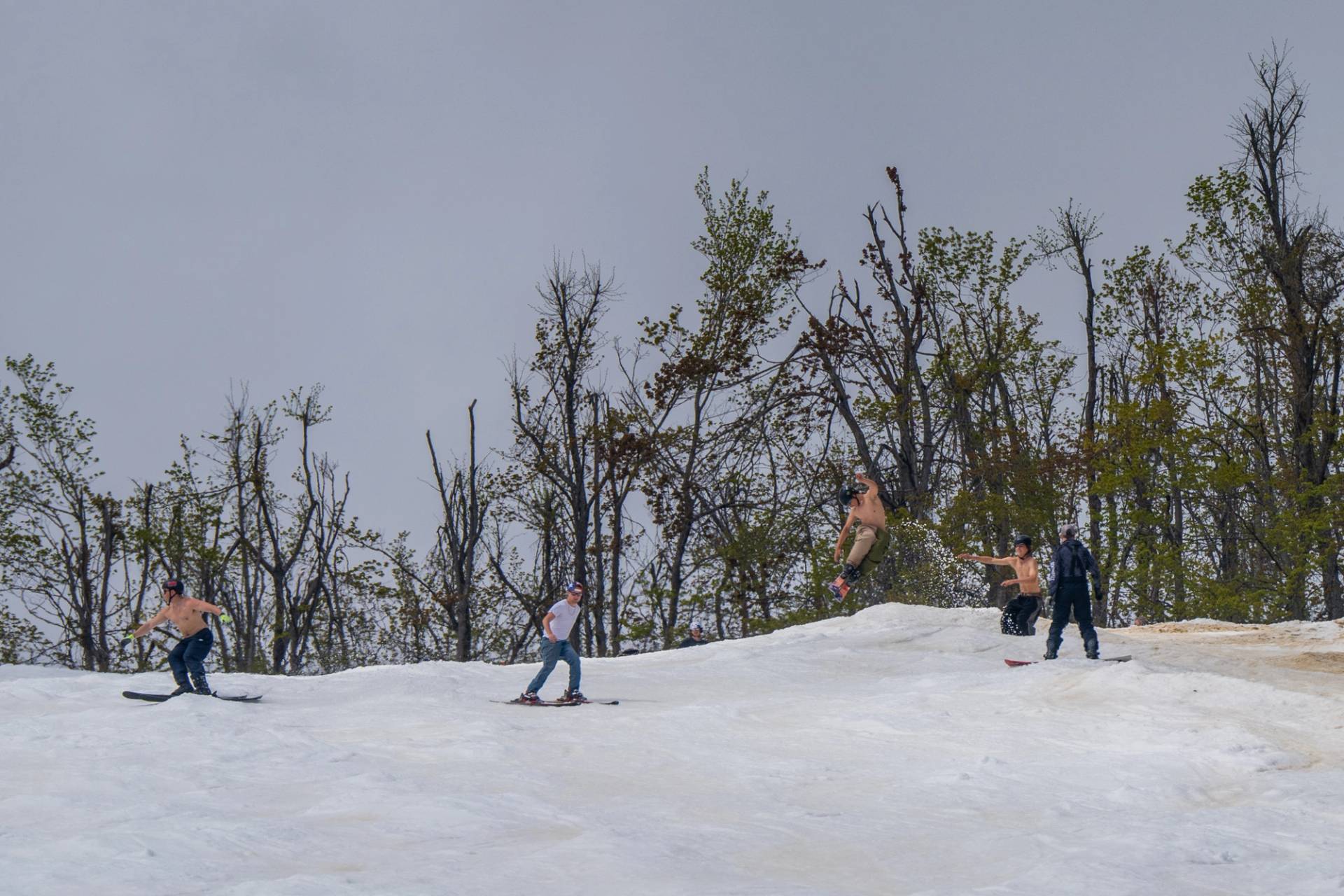 skiers hitting jump