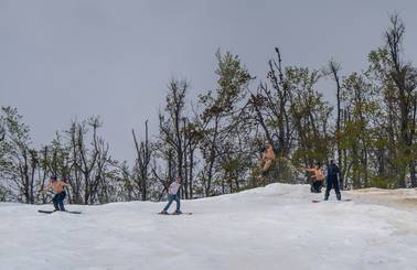 skiers hitting jump