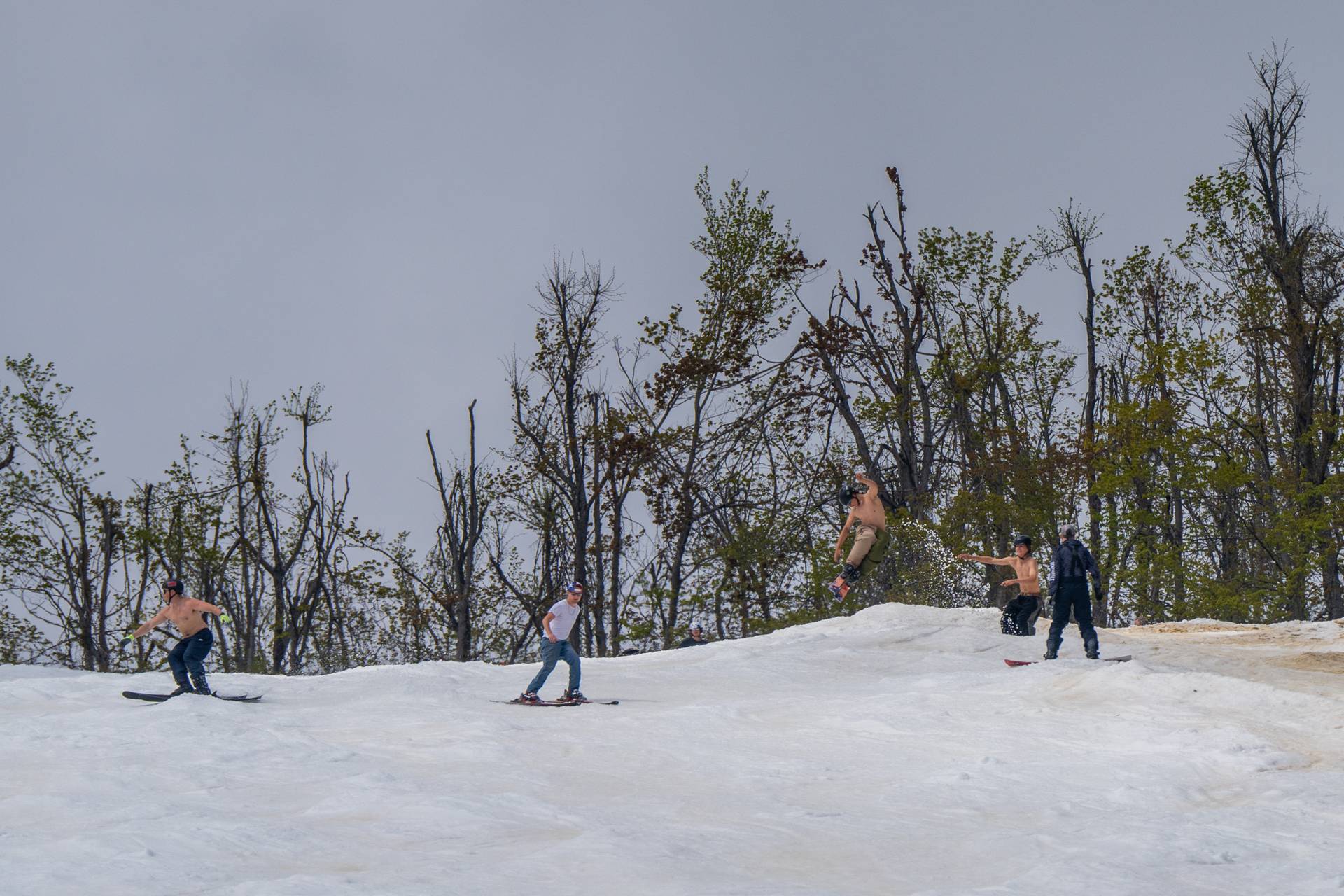 skiers hitting jump