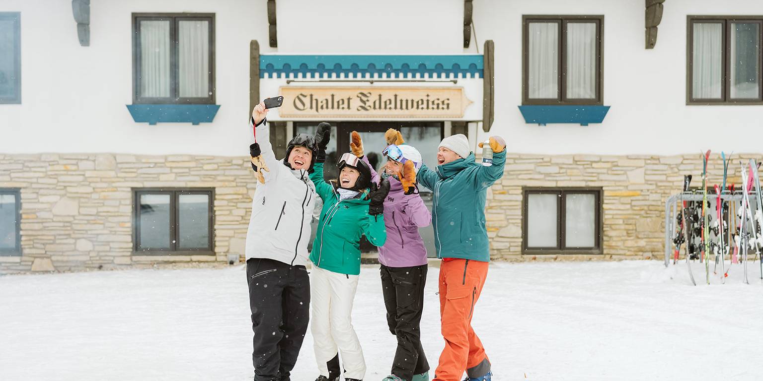 People outside of Chalet Edelweiss cheering