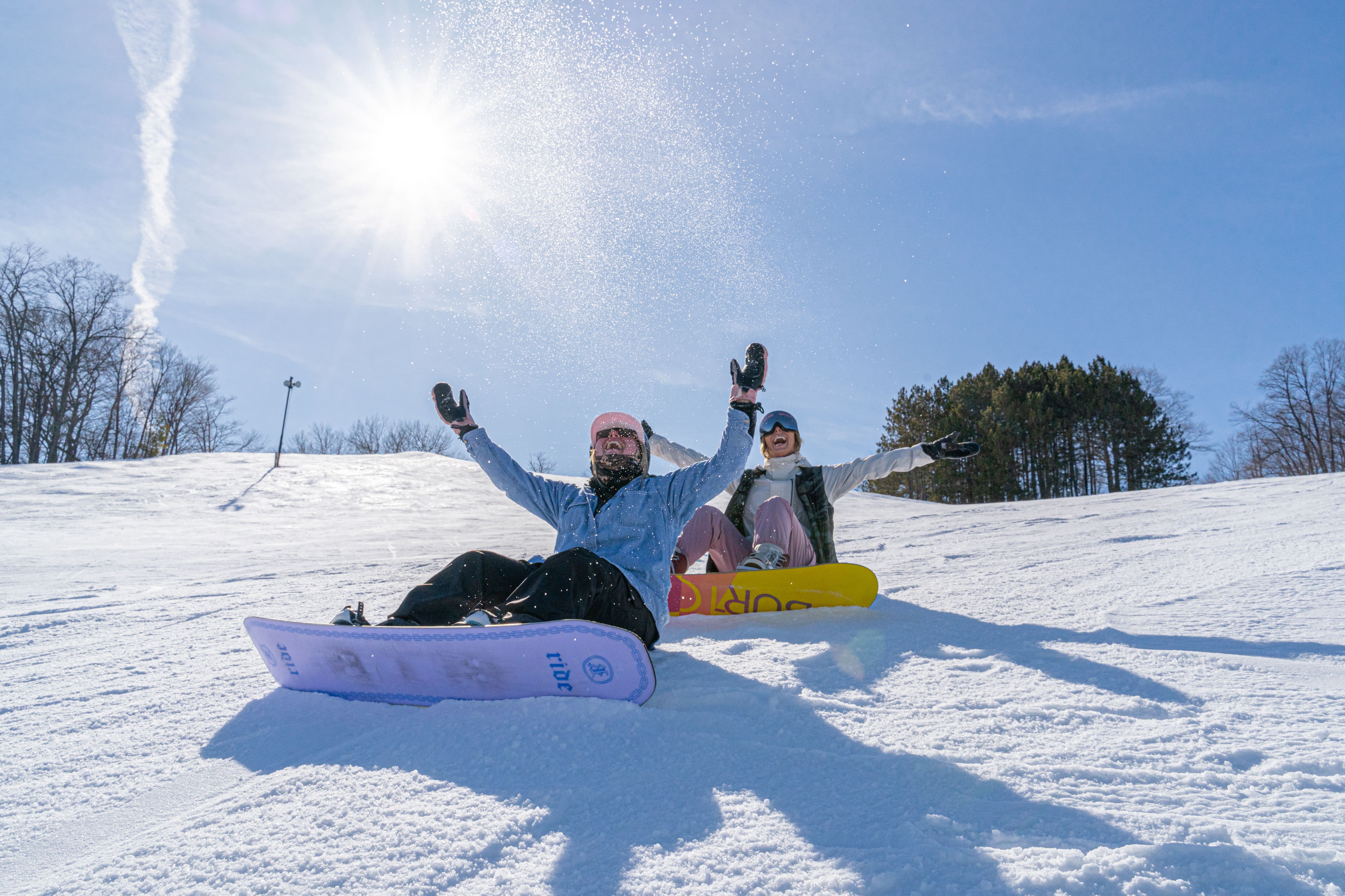 girls snowboarding in spring at Boyne Mountain
