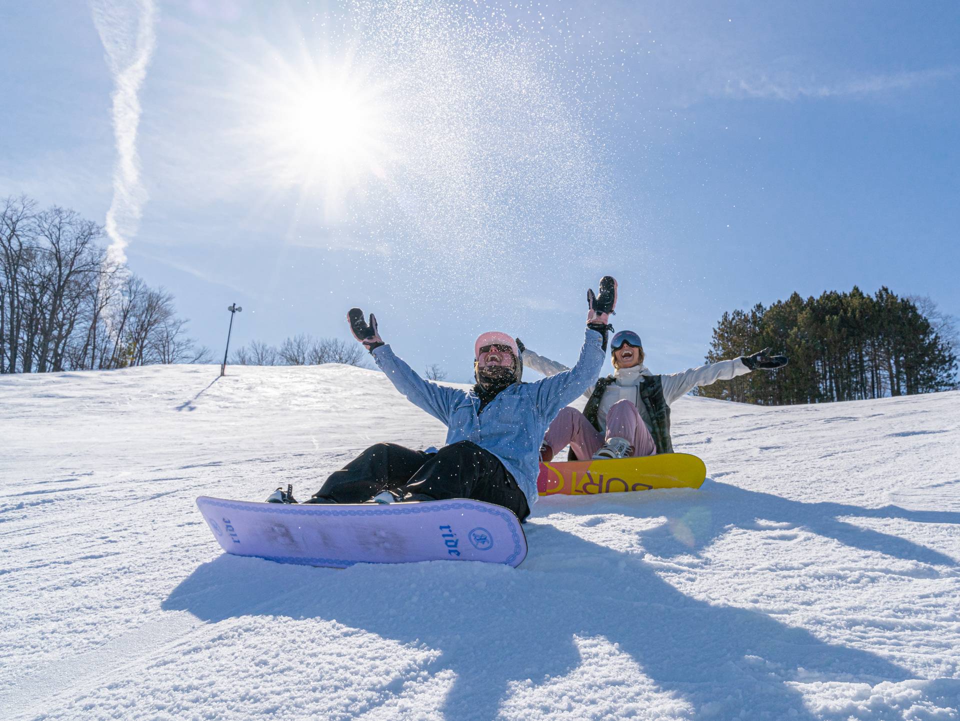 girls snowboarding in spring at Boyne Mountain