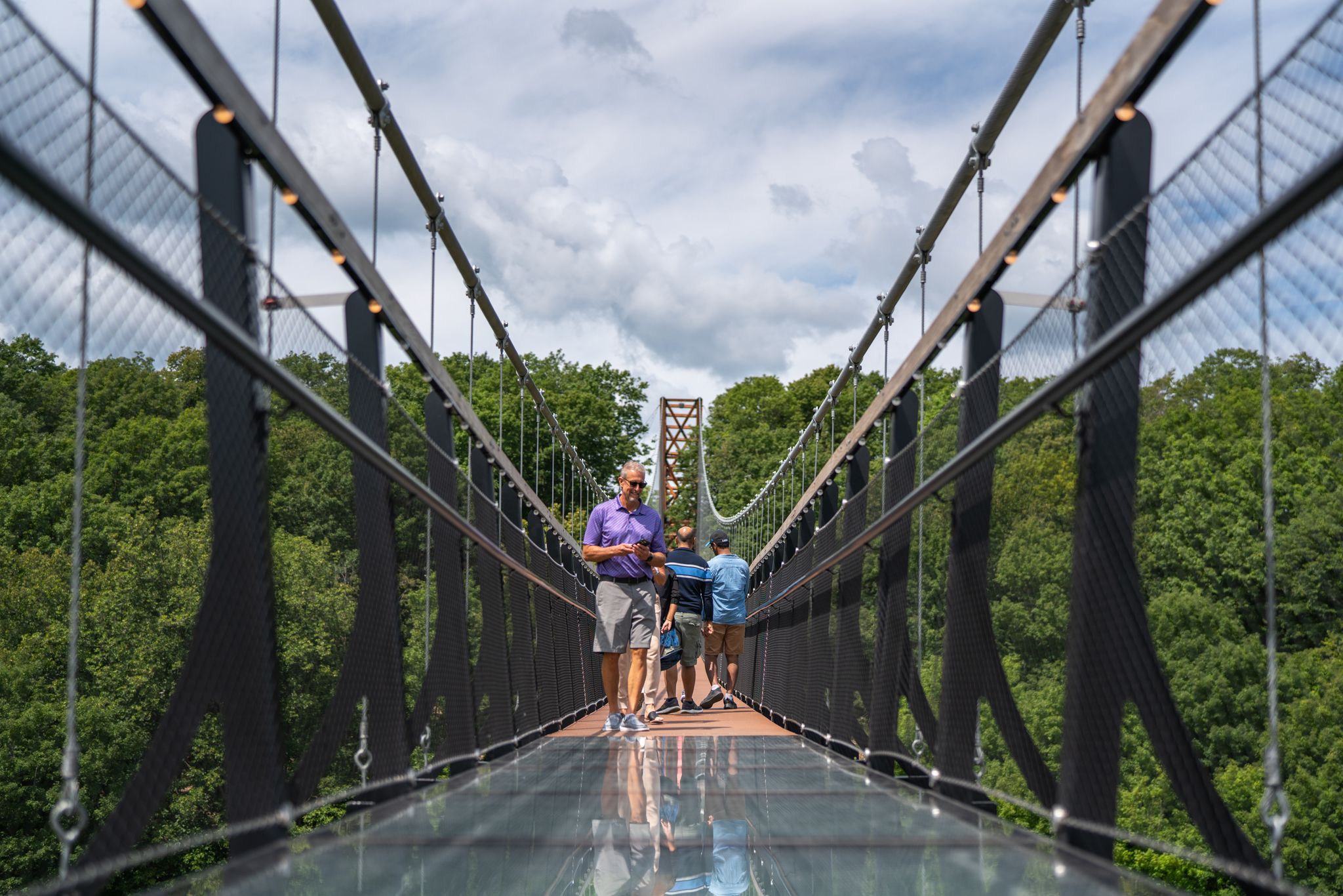 guy walking on skybridge michigan 