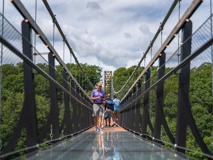 guy walking on skybridge michigan