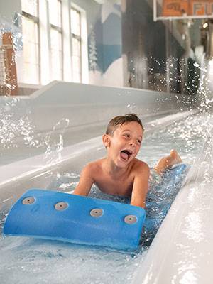 Boy on Mat Racer at waterpark
