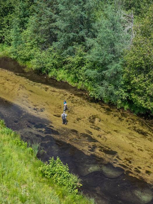 Two people flyfishing in the Jordan river