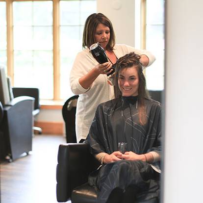 Woman getting a blow out at The Spa