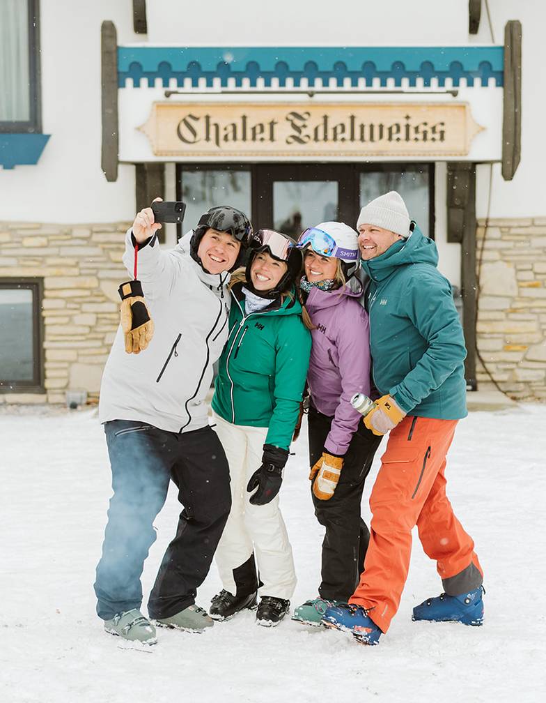 Couples posing outside Chalet Edelweiss