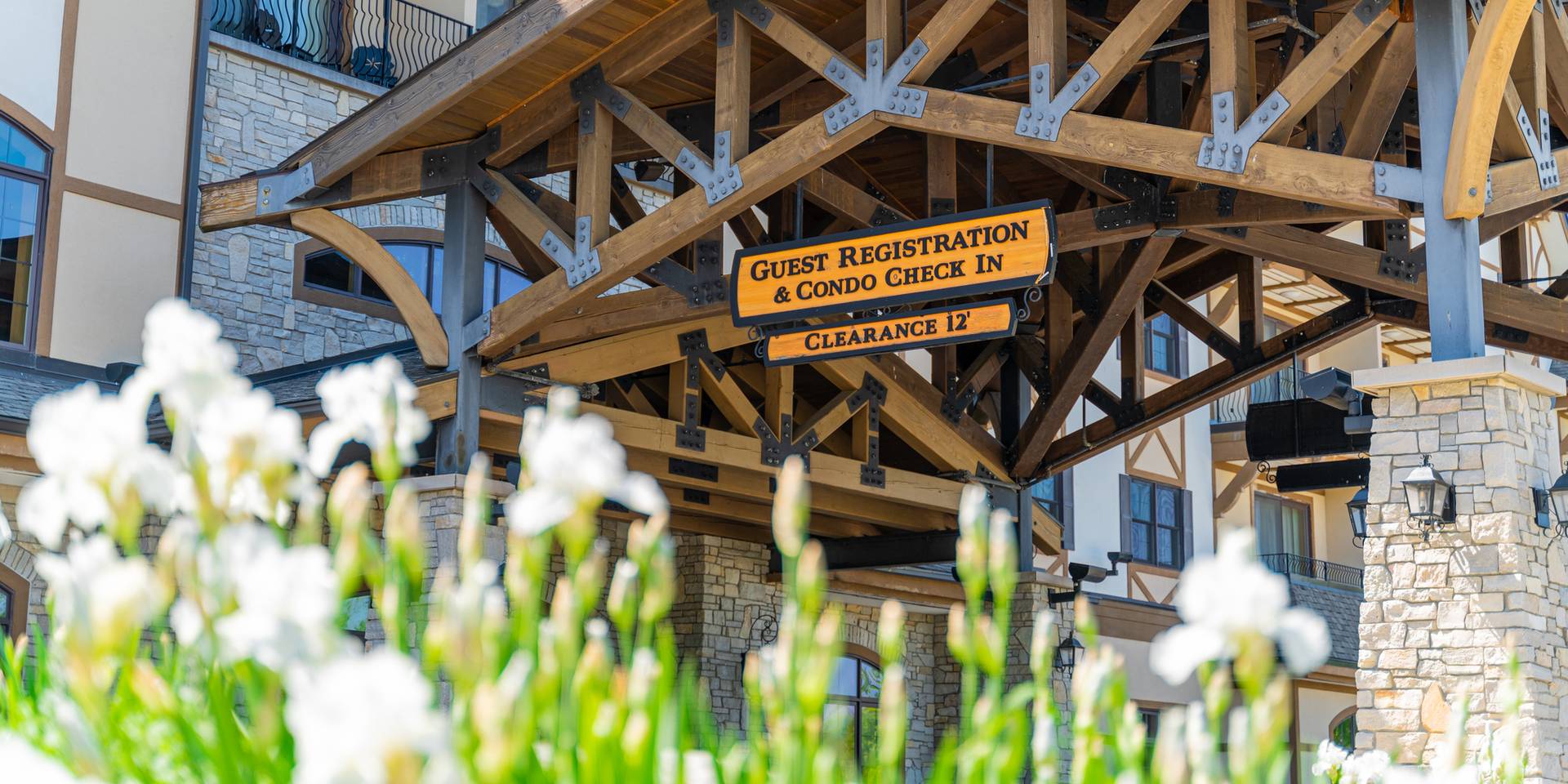 Guest Registration front entrance at the Mountain Grand Lodge and Spa with flowers