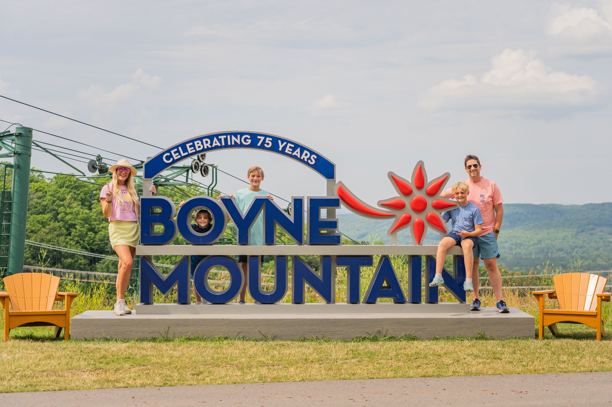 family at the top of boyne mountain in the summer