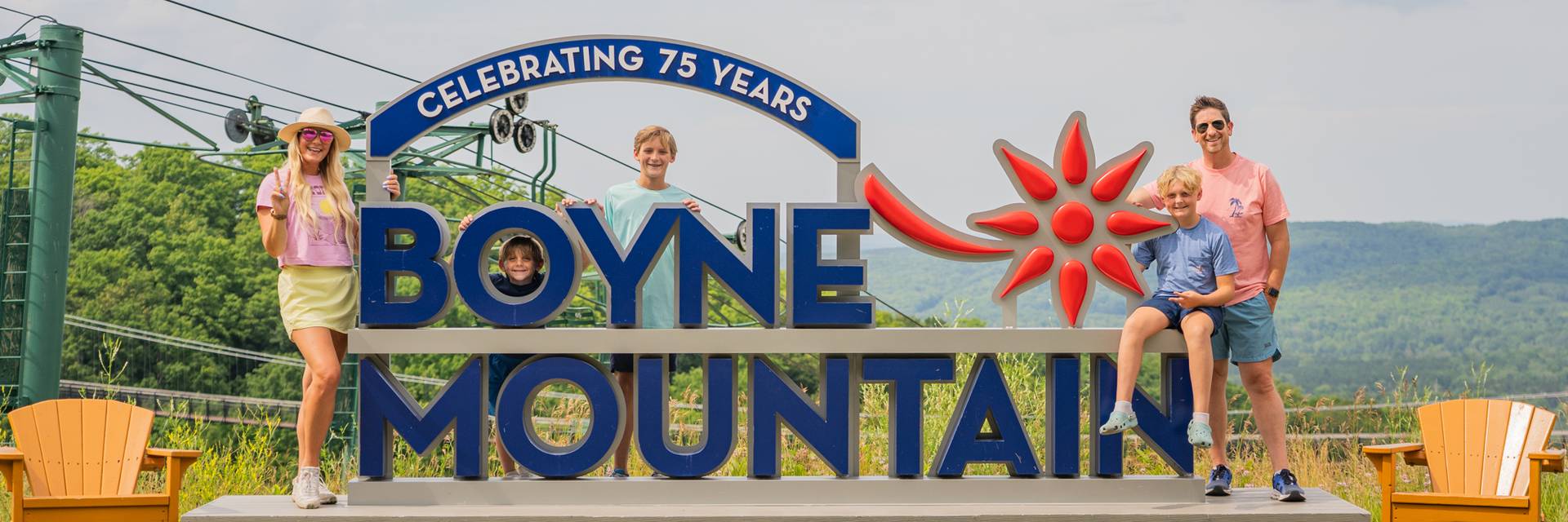 family at the top of boyne mountain in the summer