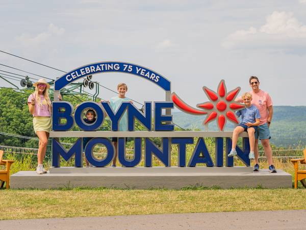 family at the top of boyne mountain in the summer