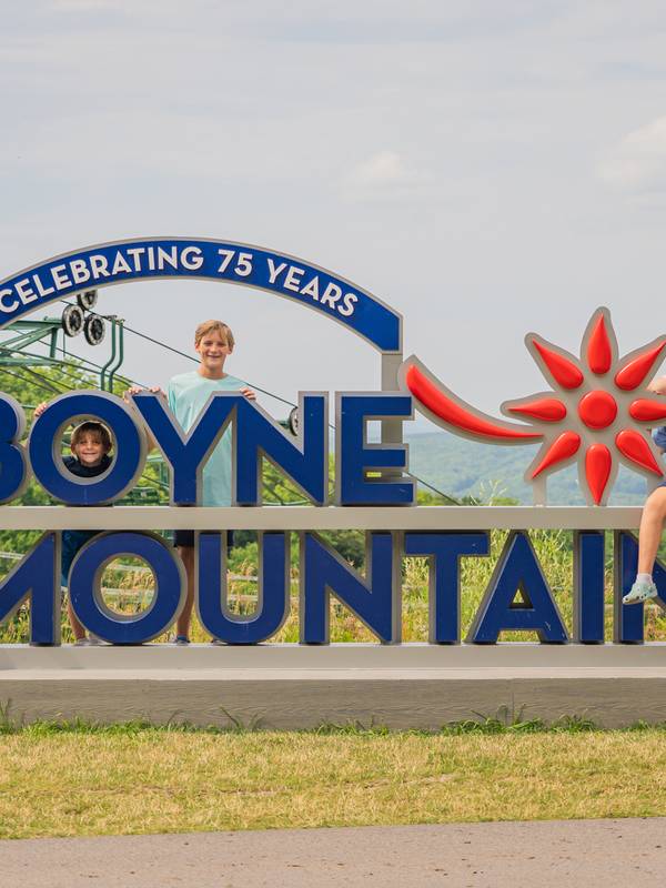 family at the top of boyne mountain in the summer