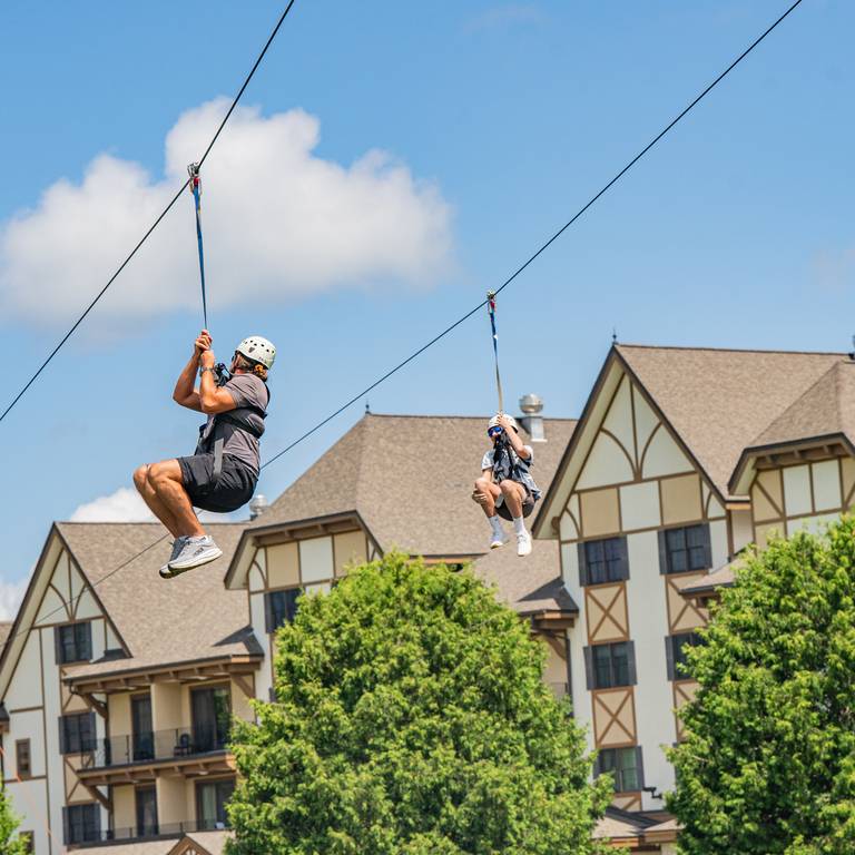 parent and child ziplining together