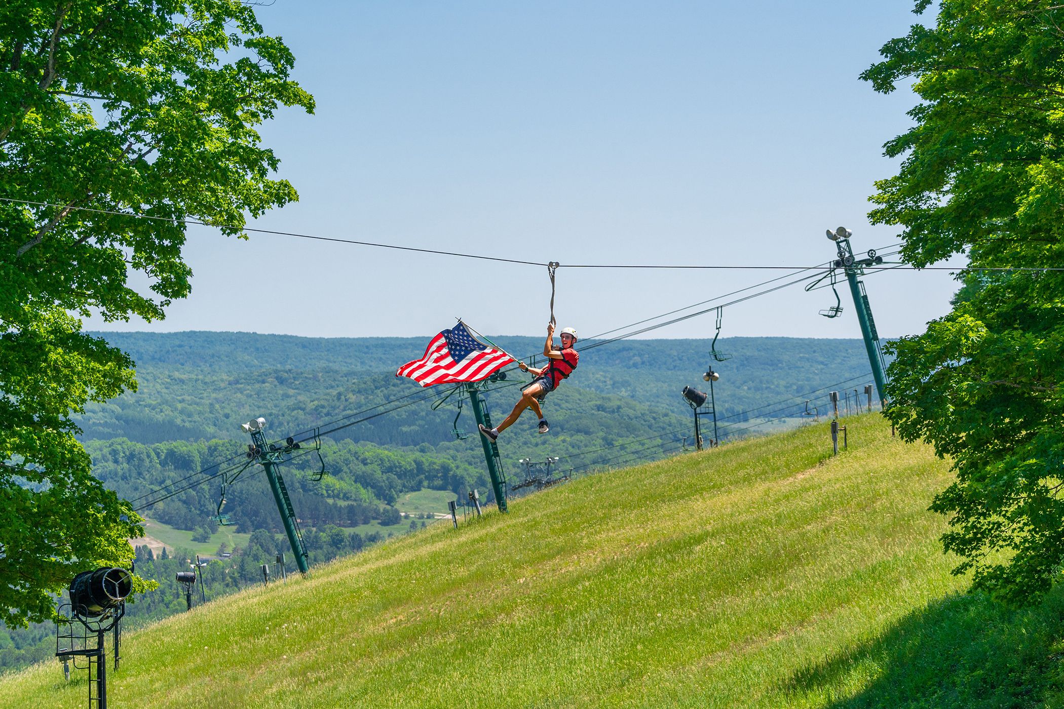 Ziplining with American Flag at Boyne Mountain Resort