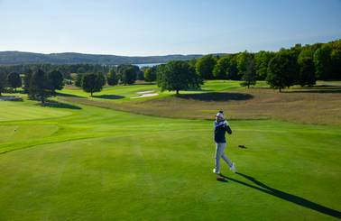 golfer taking swing