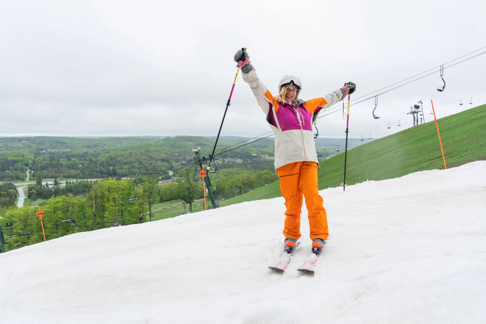 Skier holding up poles on Victor Glacier