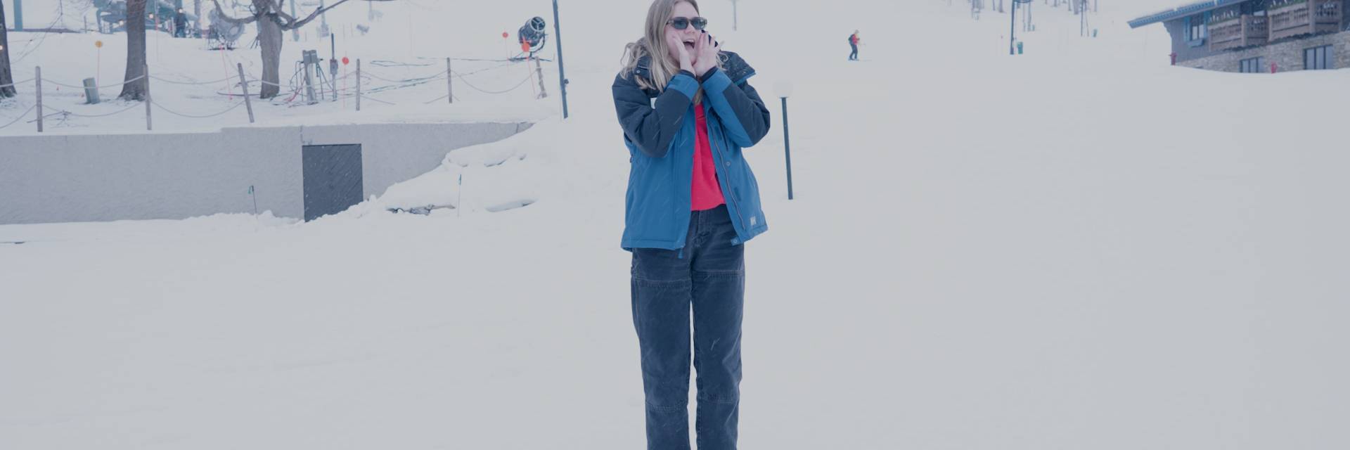 Woman shouting in front of ski slope