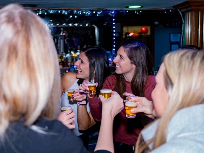 Ladies smiling with drinks
