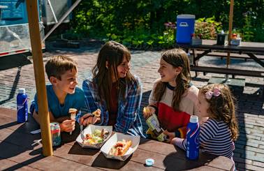 family having lunch at skybridge food truck