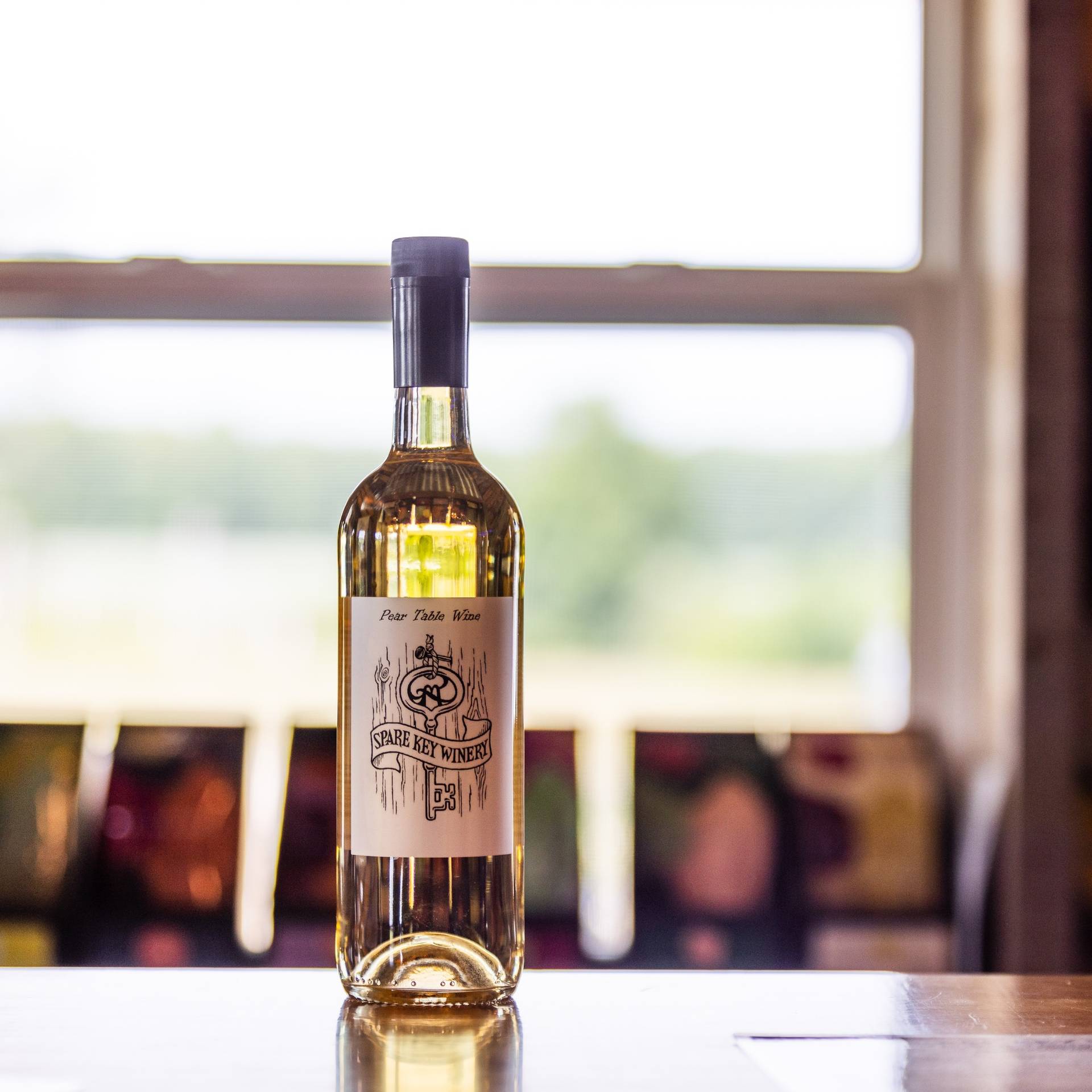 Bottle of wine from Spare Key Winery sitting on table