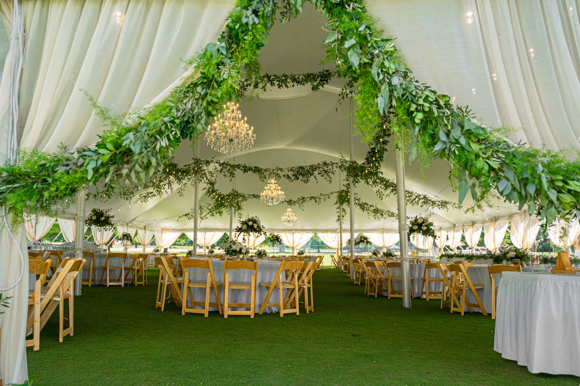deer lake wedding tent setup with flowers
