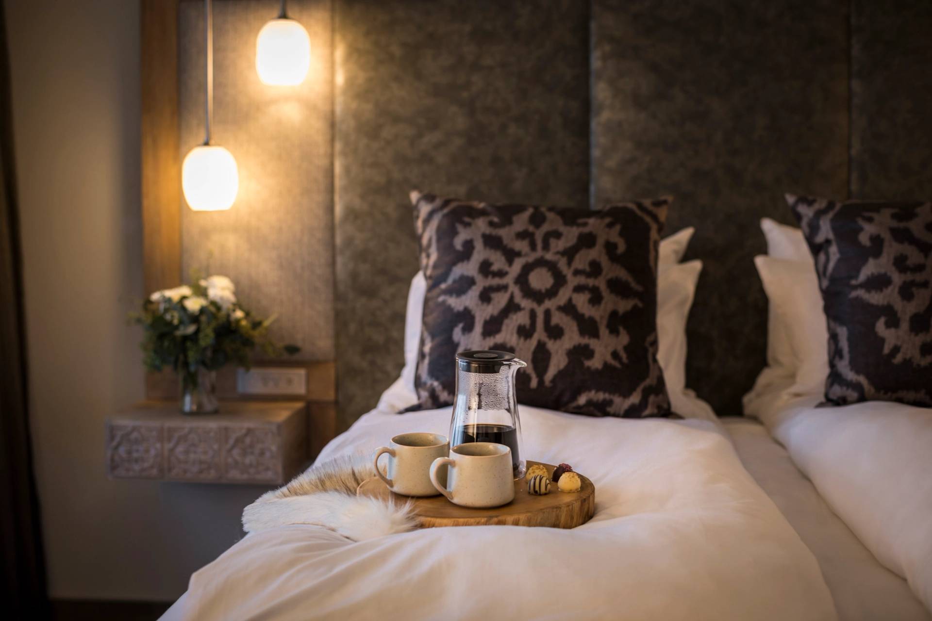 Bed with coffee display inside Chalet Edelweiss.