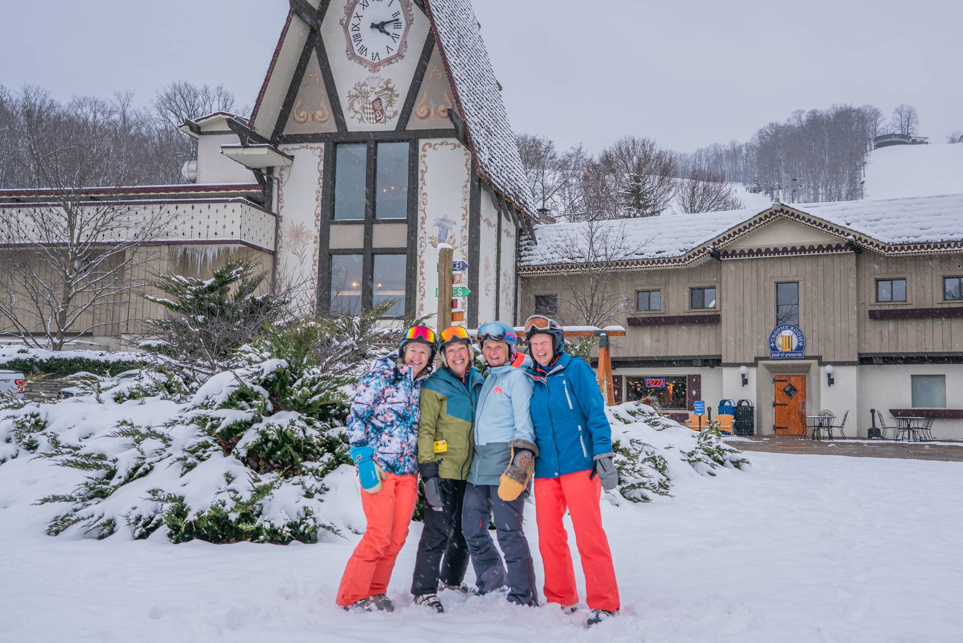 ladies posing in front of Clock Tower Lodge