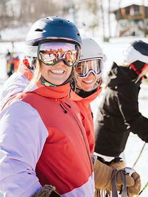 Two ladies smiling in the lift line