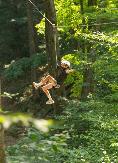 kid smiling on zipline tour