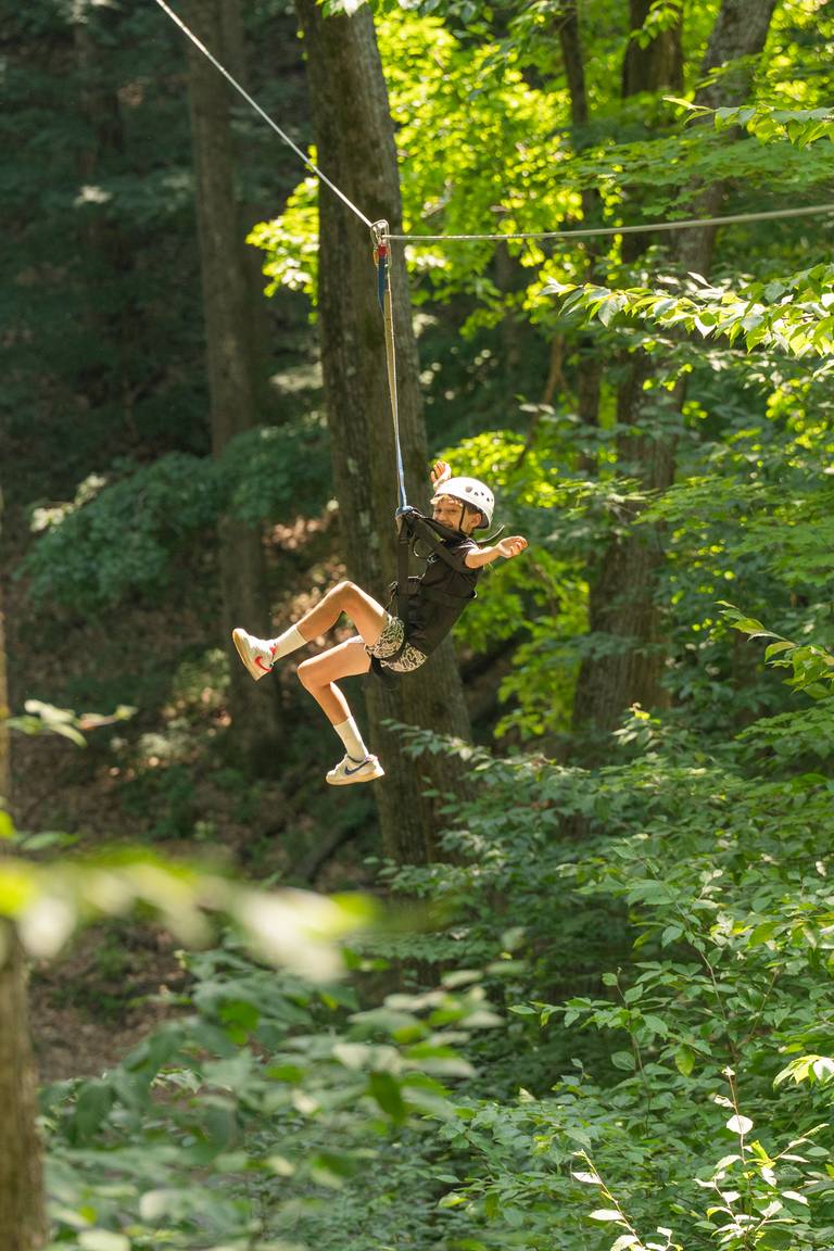 kid smiling on zipline tour
