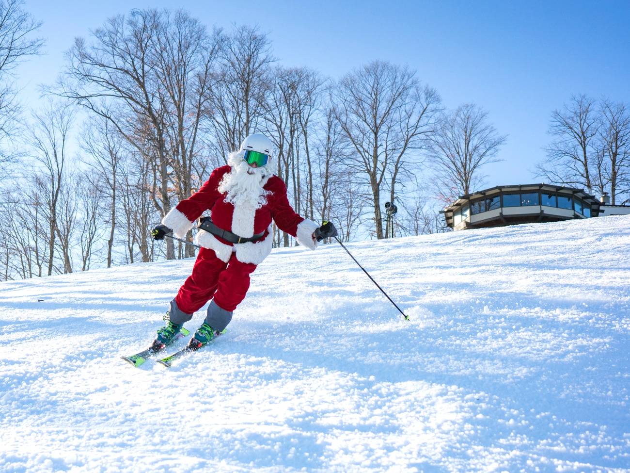 Man with santa costume skiing down Hemlock