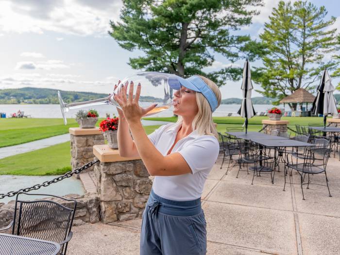 Woman drinking Large wine glass at the Beach House Restaurant