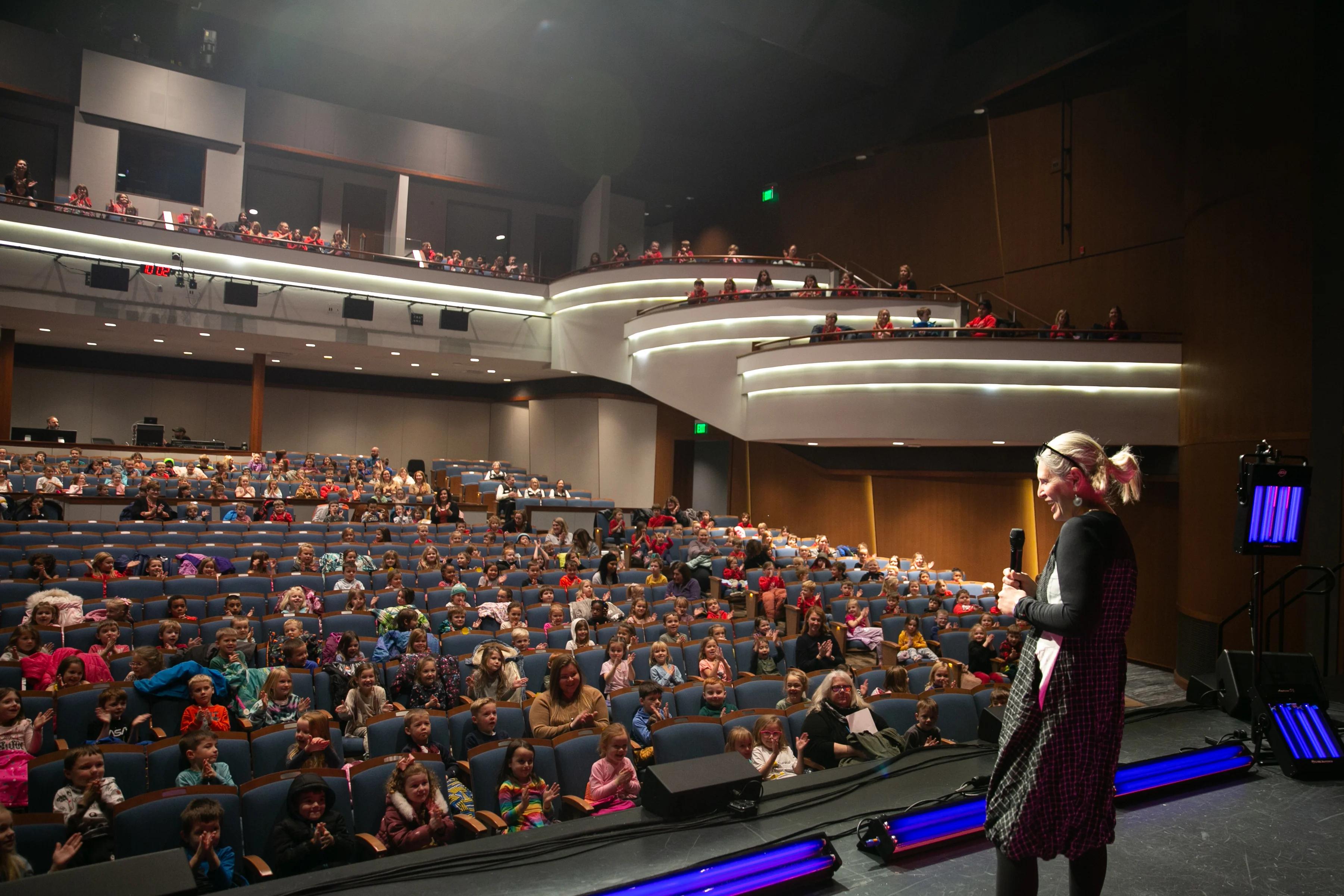 public speaker talking to kids at Great Lakes Center For The Arts