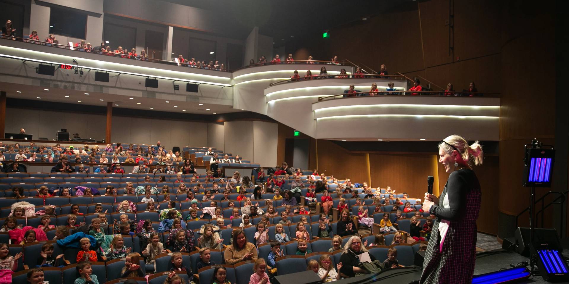 public speaker talking to kids at Great Lakes Center For The Arts