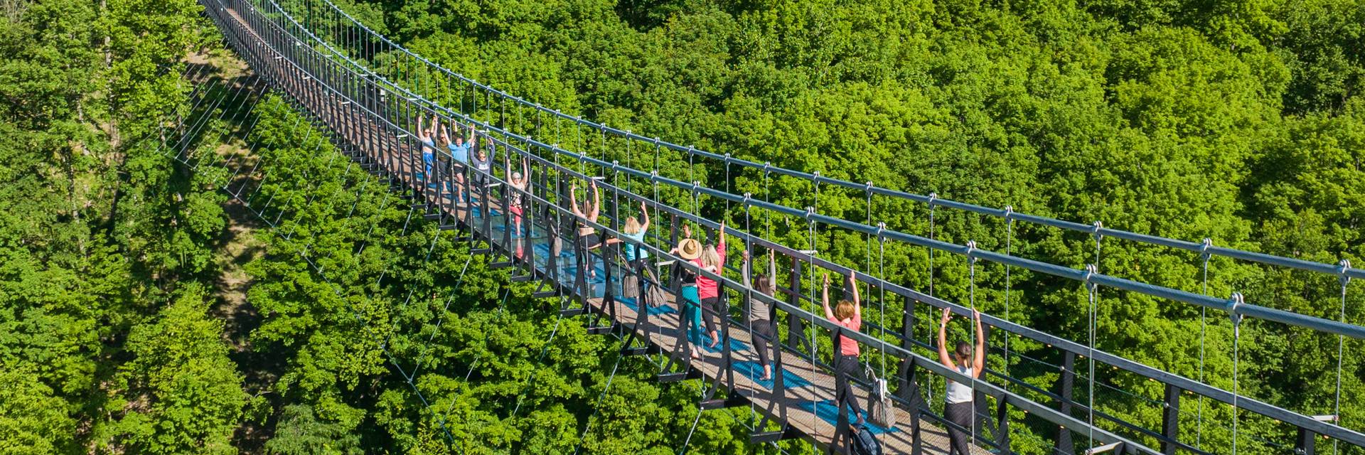 People on SkyBridge Michigan doing yoga