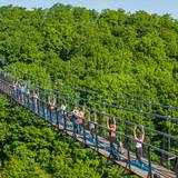 People on SkyBridge Michigan doing yoga