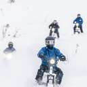 people riding moonbikes