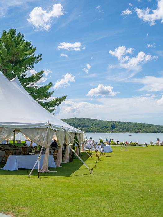 Tent on the Beach House lawn with lake in the background
