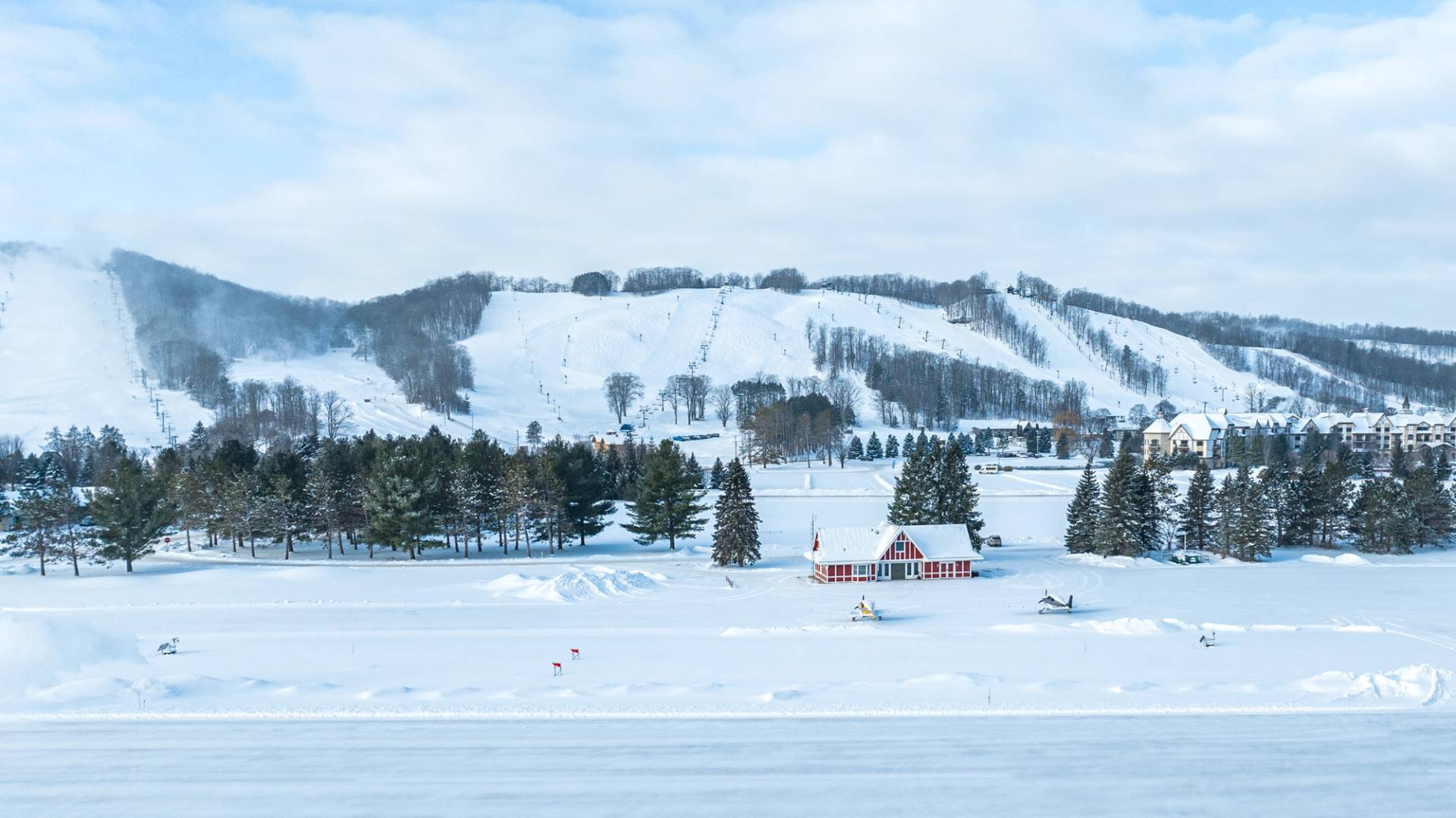 Airport in the winter after upgrades with Boyne Mountain Ski hills in the background.