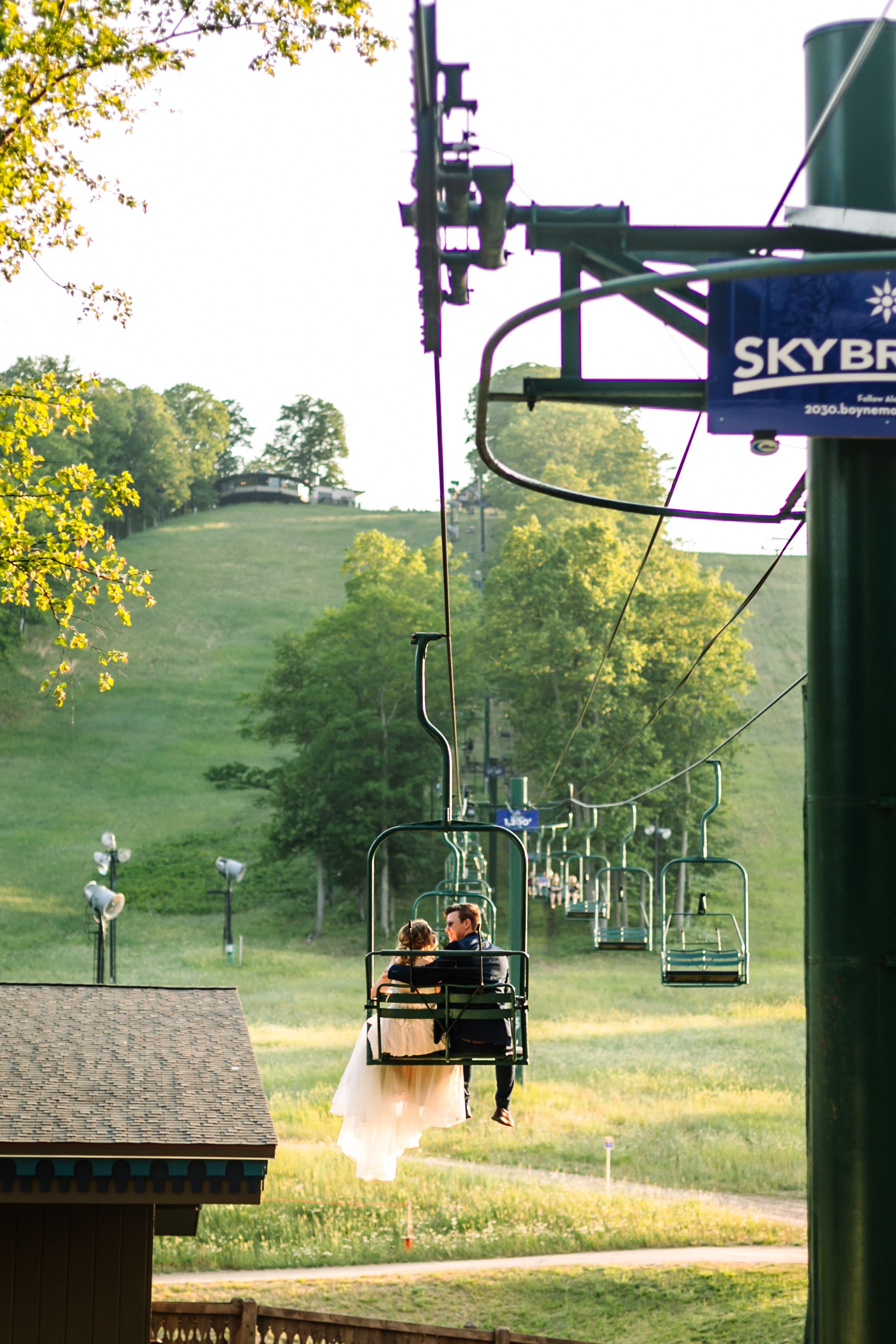 couple riding up hemlock lift