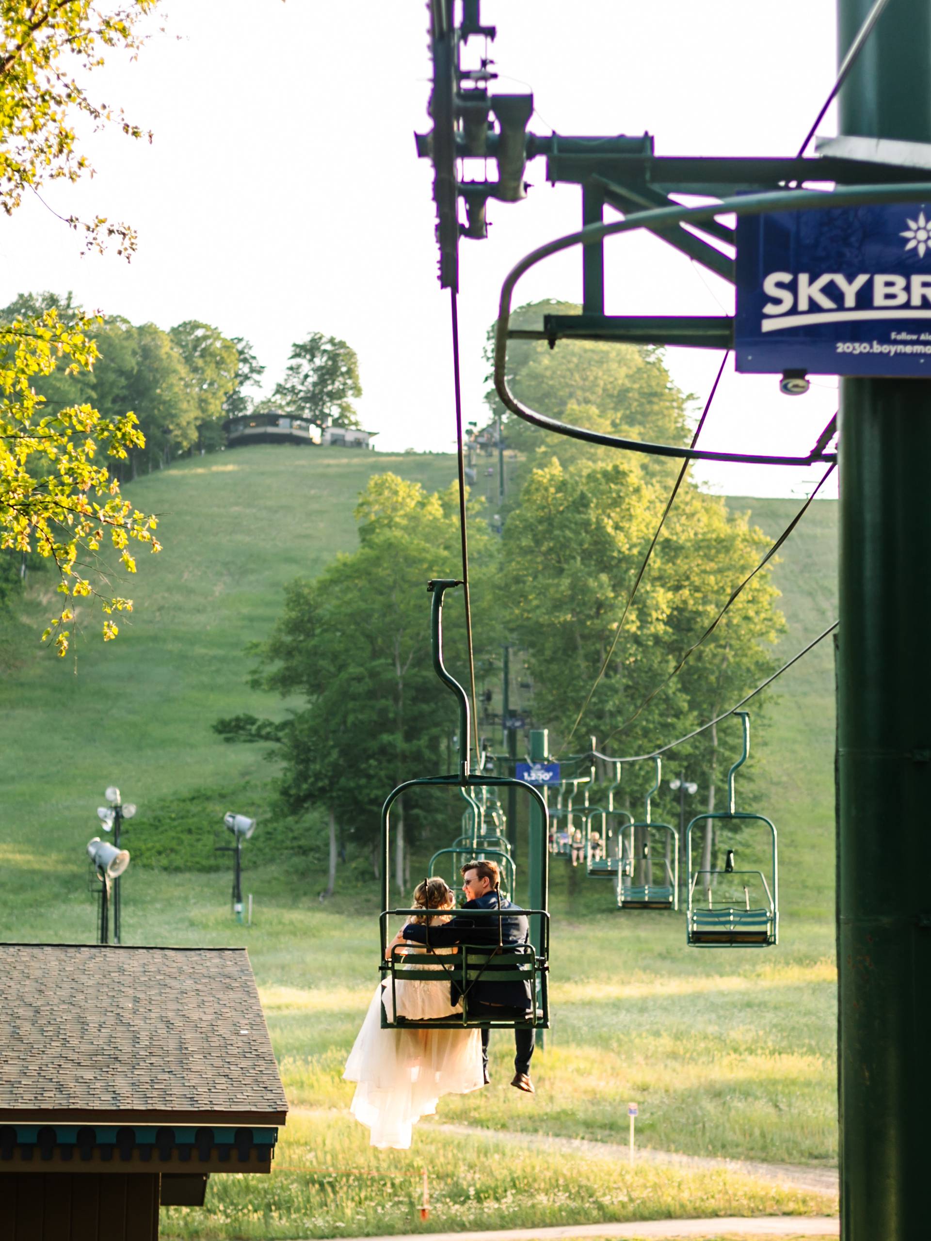 couple riding up hemlock lift