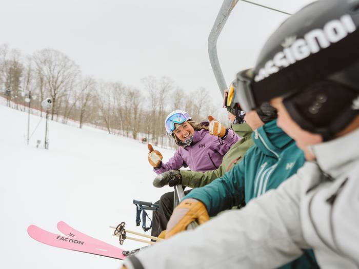 girl smiling on chairlift