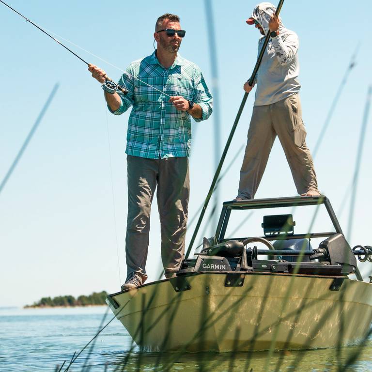 two guys fishing on a boat