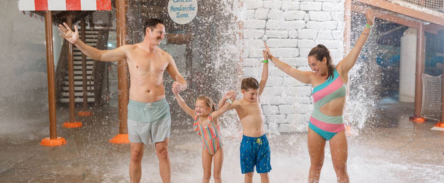 family at Avalanche Bay waterpark