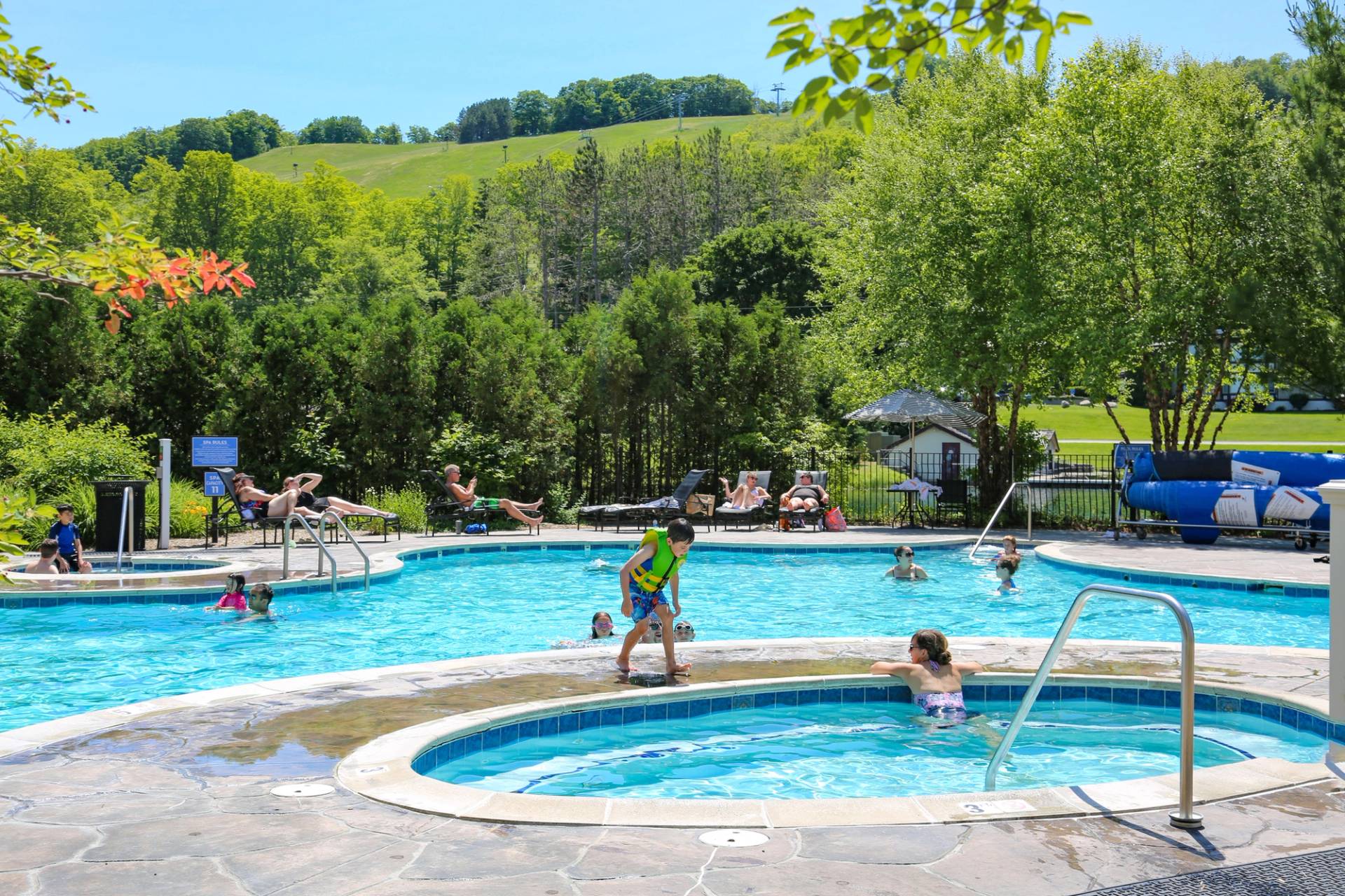Families enjoying the Mountain Grand Lodge and Spa pool