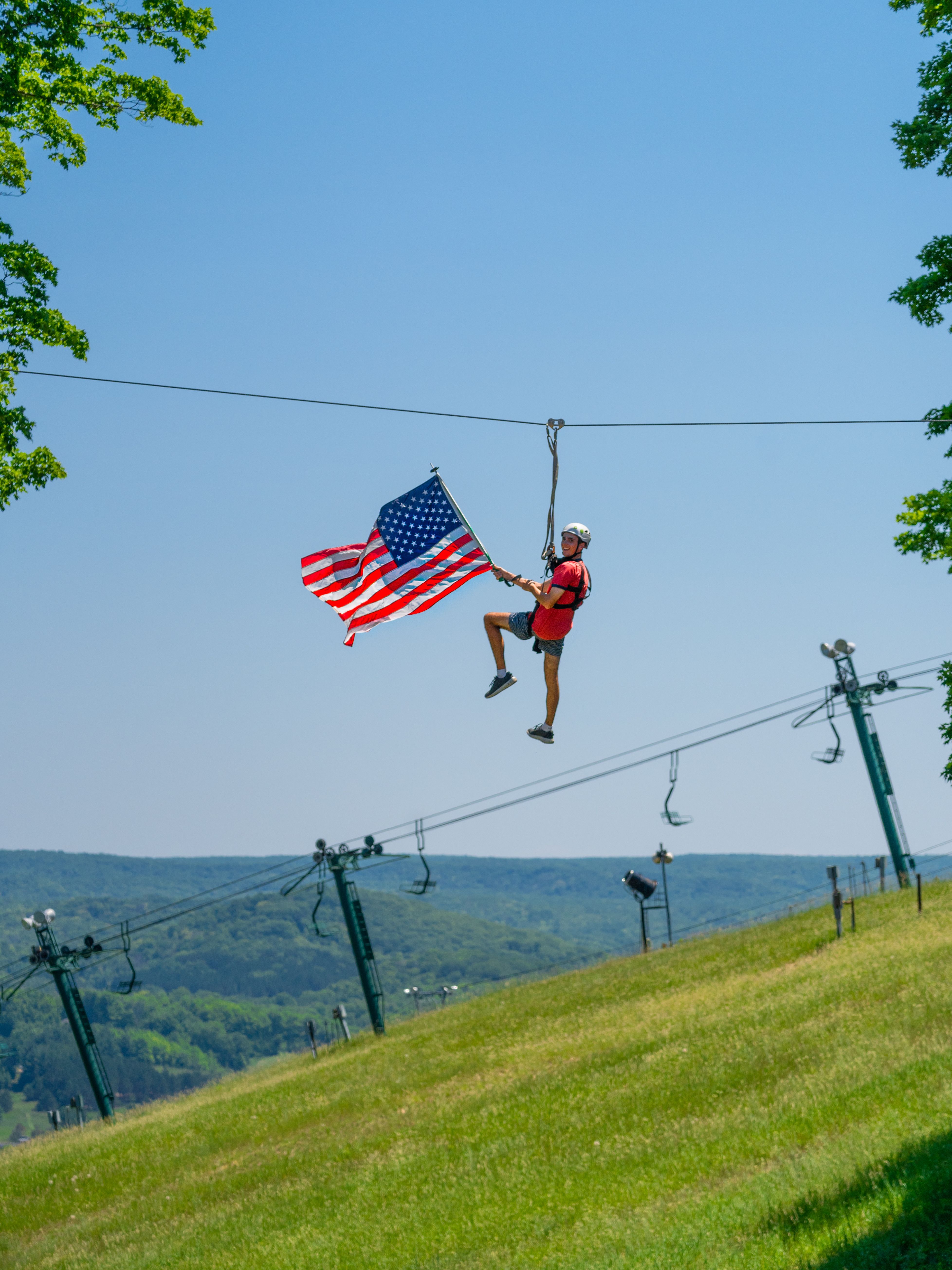 ziplining with flag