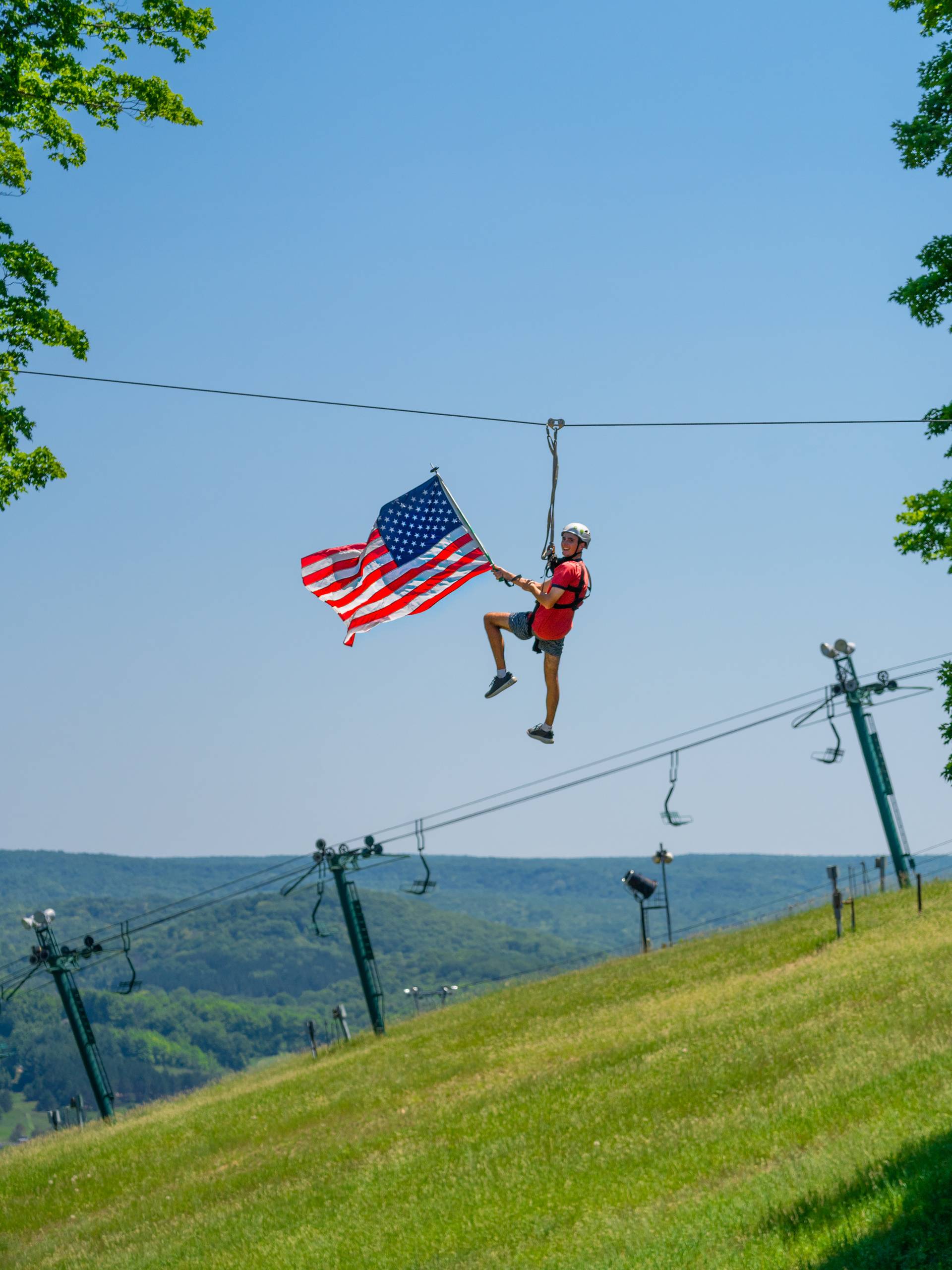 ziplining with flag