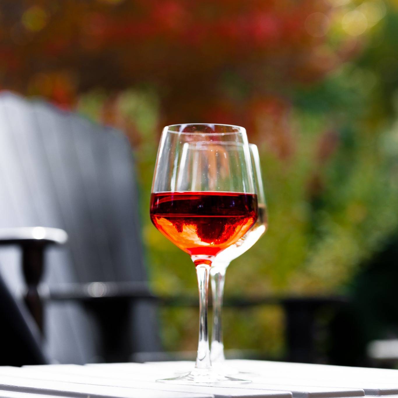 Two glasses of wine on a table